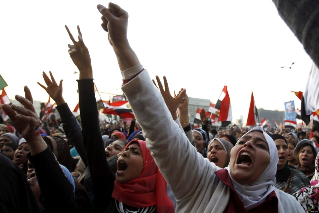 Women shout during a protest in Tahrir Square in Cairo January 25, 2013. Protesters clashed with police across Egypt on Friday on the second anniversary of the revolt that toppled Hosni Mubarak, taking to the streets against the elected Islamist president who they accuse of betraying the revolution . REUTERS/Mohamed Abd El Ghany (EGYPT - Tags: POLITICS CIVIL UNREST)