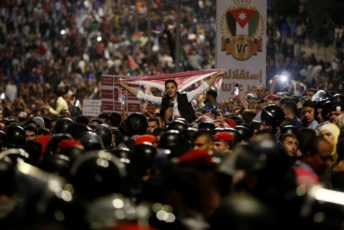 Protesters shout slogans during a protest in Amman